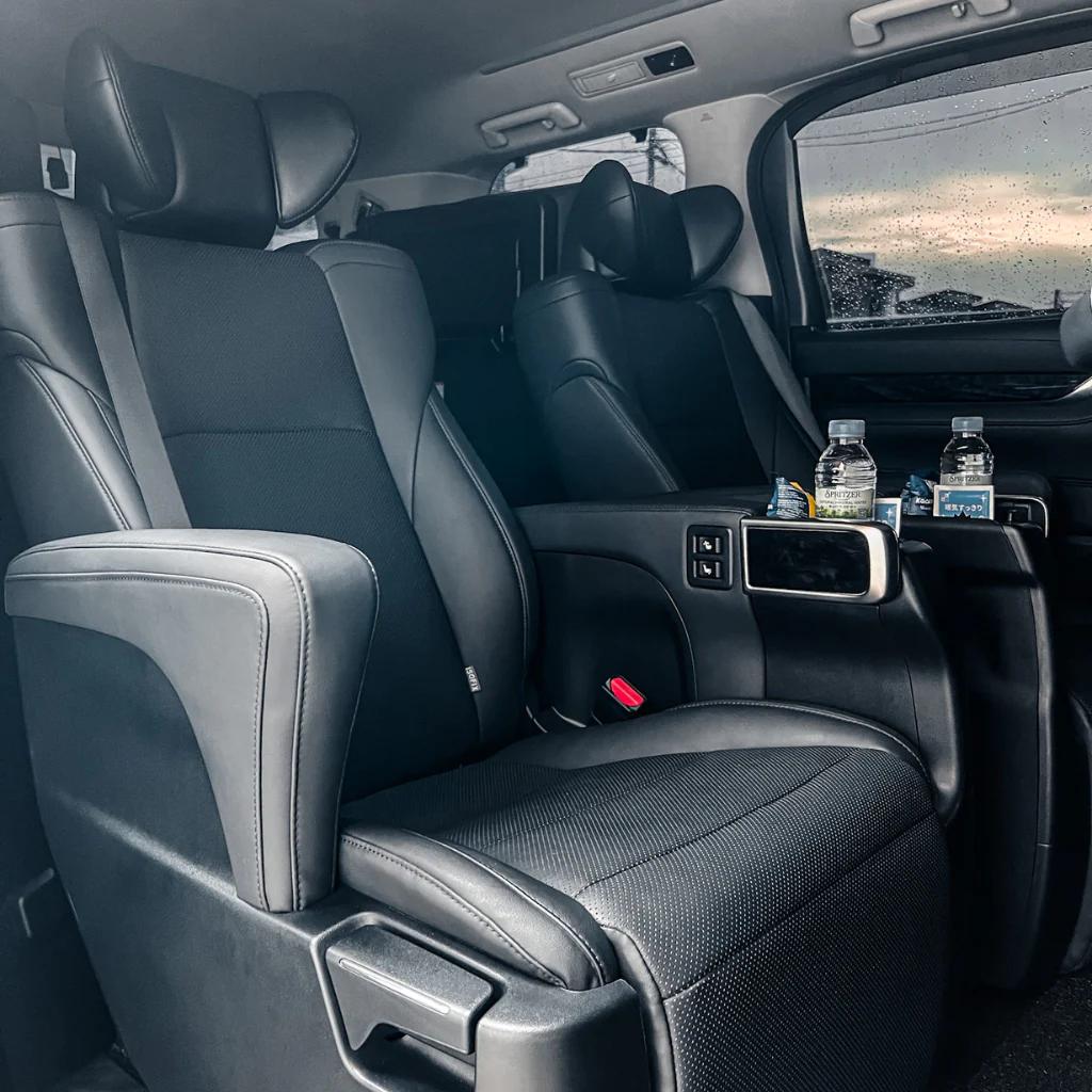 Ellrae executive captain seat interior with bottled water and spacious passenger comfort