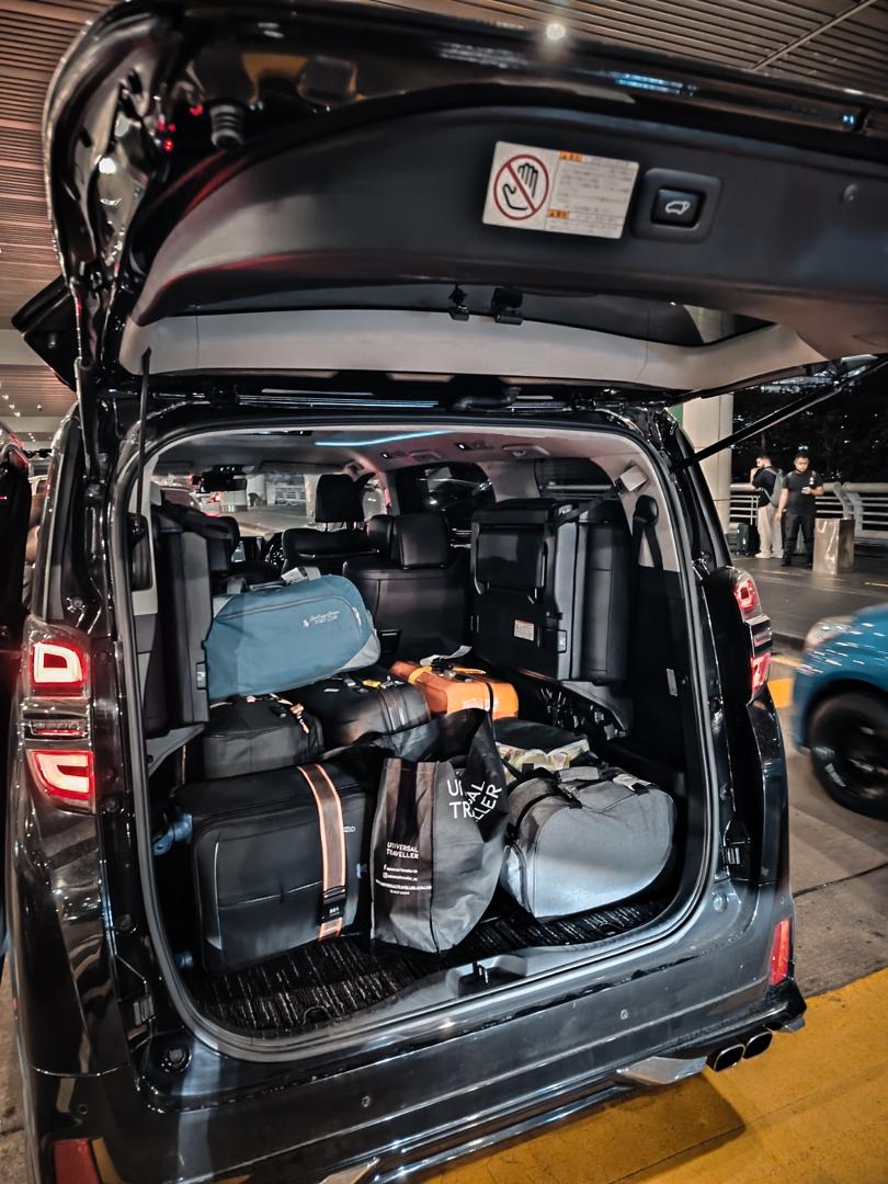 Ellrae MPV loaded with airport luggage at night pickup